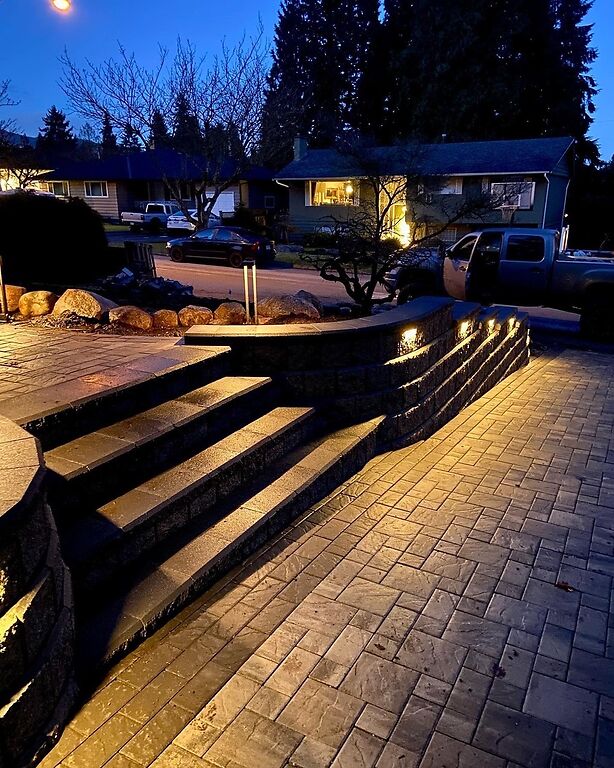 Full yard landscape design in Port Moody with landscape lighting. Benjamin Landscaping and Projects. 