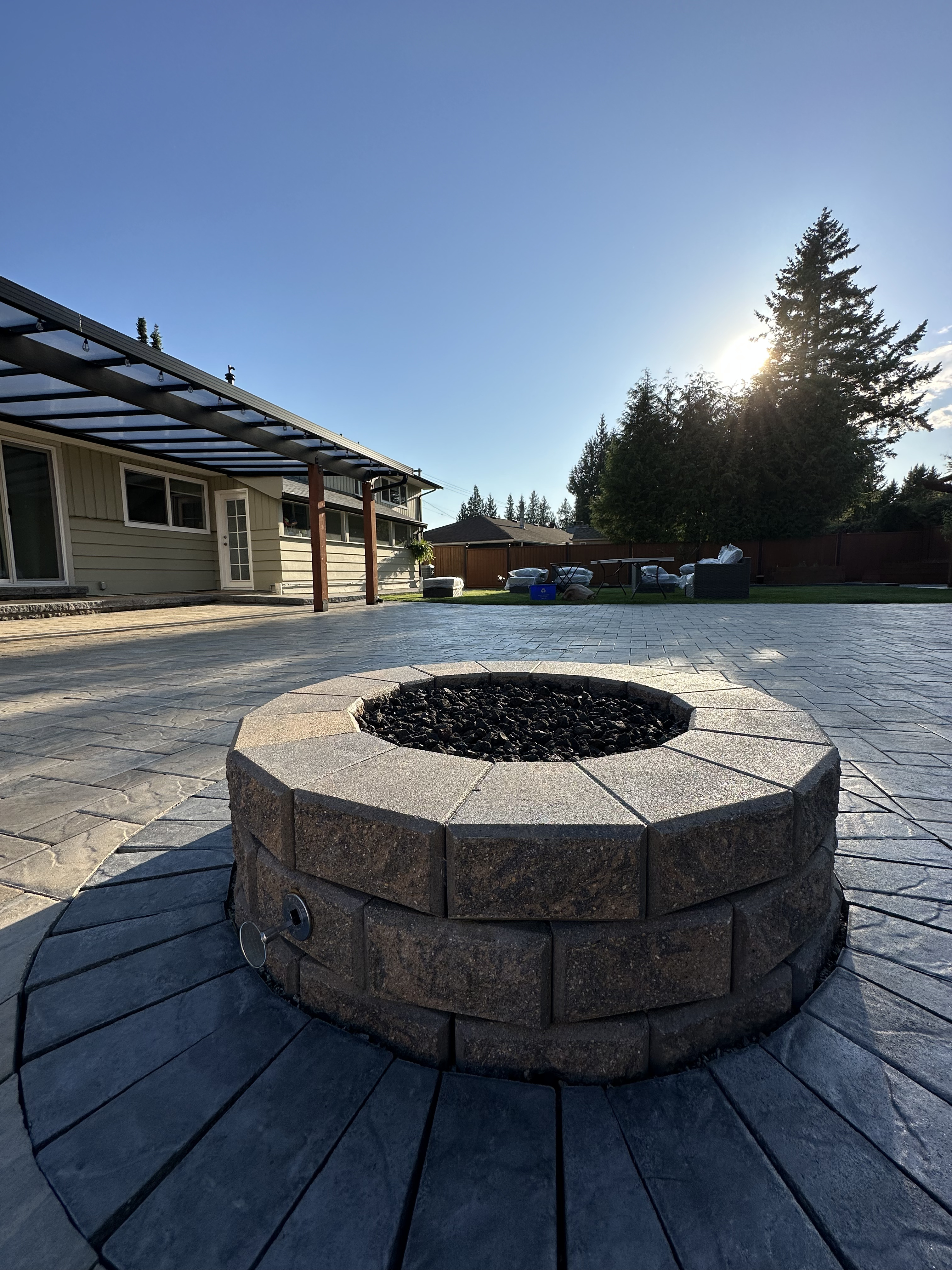 Outdoor fire pit in Maple Ridge built by Benjamin Landscaping and Projects.