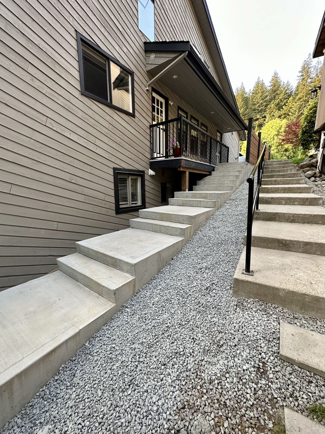 Concrete formed stairs in Port Moody by Benjamin Landscaping and Projects. 