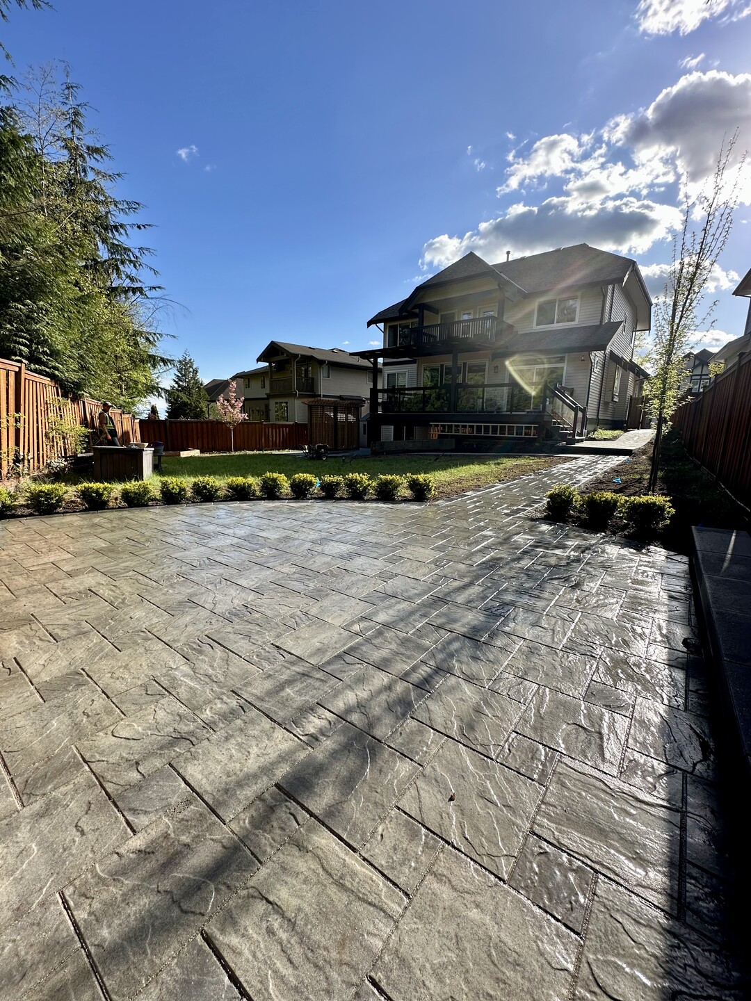 Interlocking paver patio and walkway installation in Port Moody. Landscape construction services in North Vancouver, West Vancouver, Coquitlam, White Rock, Surrey, Langley, Port Moody and Coquitlam.