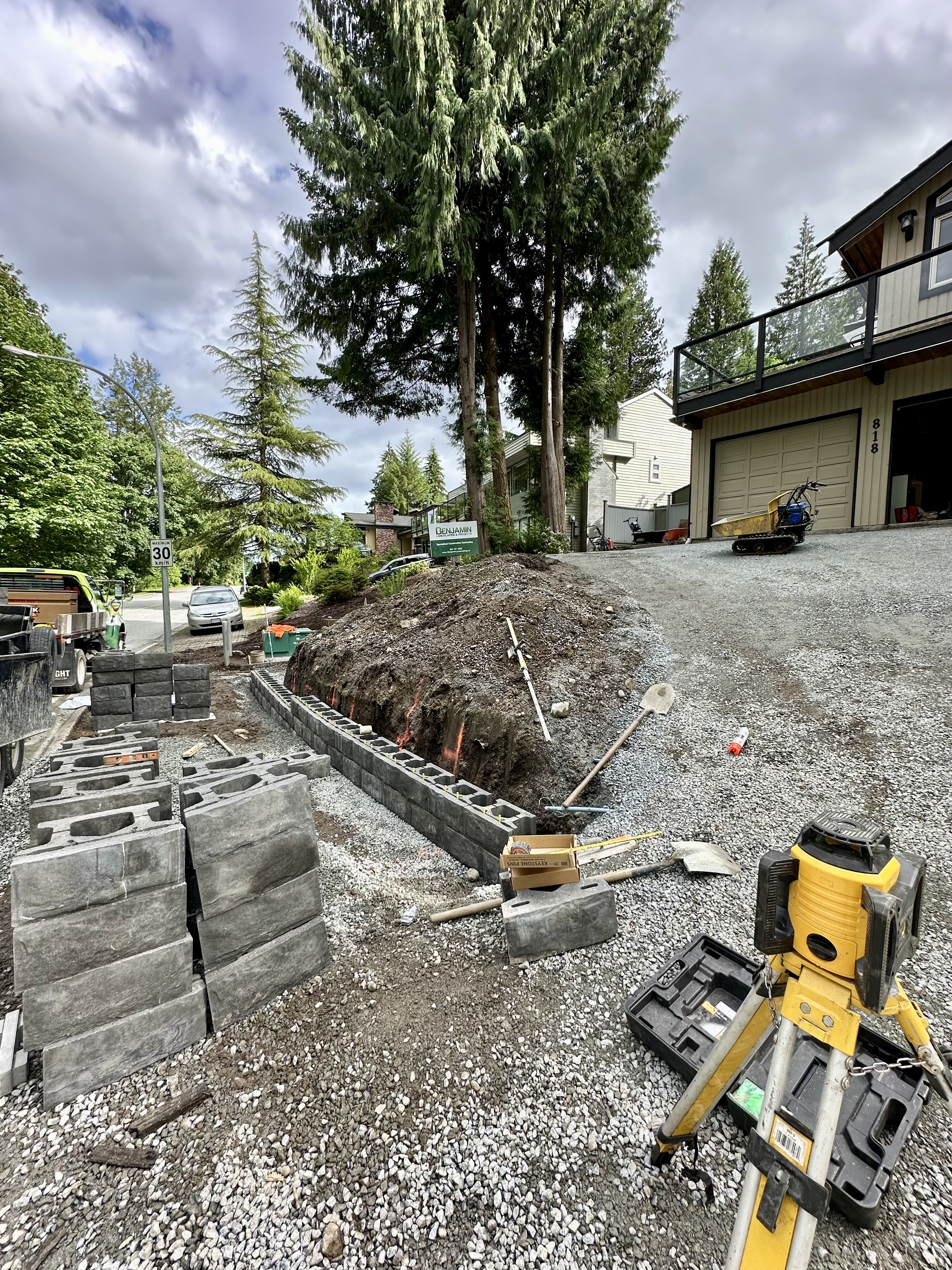 Interlocking paver driveway, retaining wall in Coquitlam by Benjamin Landscaping and Projects. 