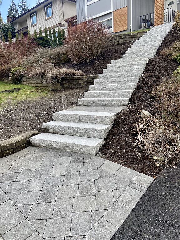 Natural stone stairs in Coquitlam with interlocking pavers. Benjamin Landscaping and Projects. 