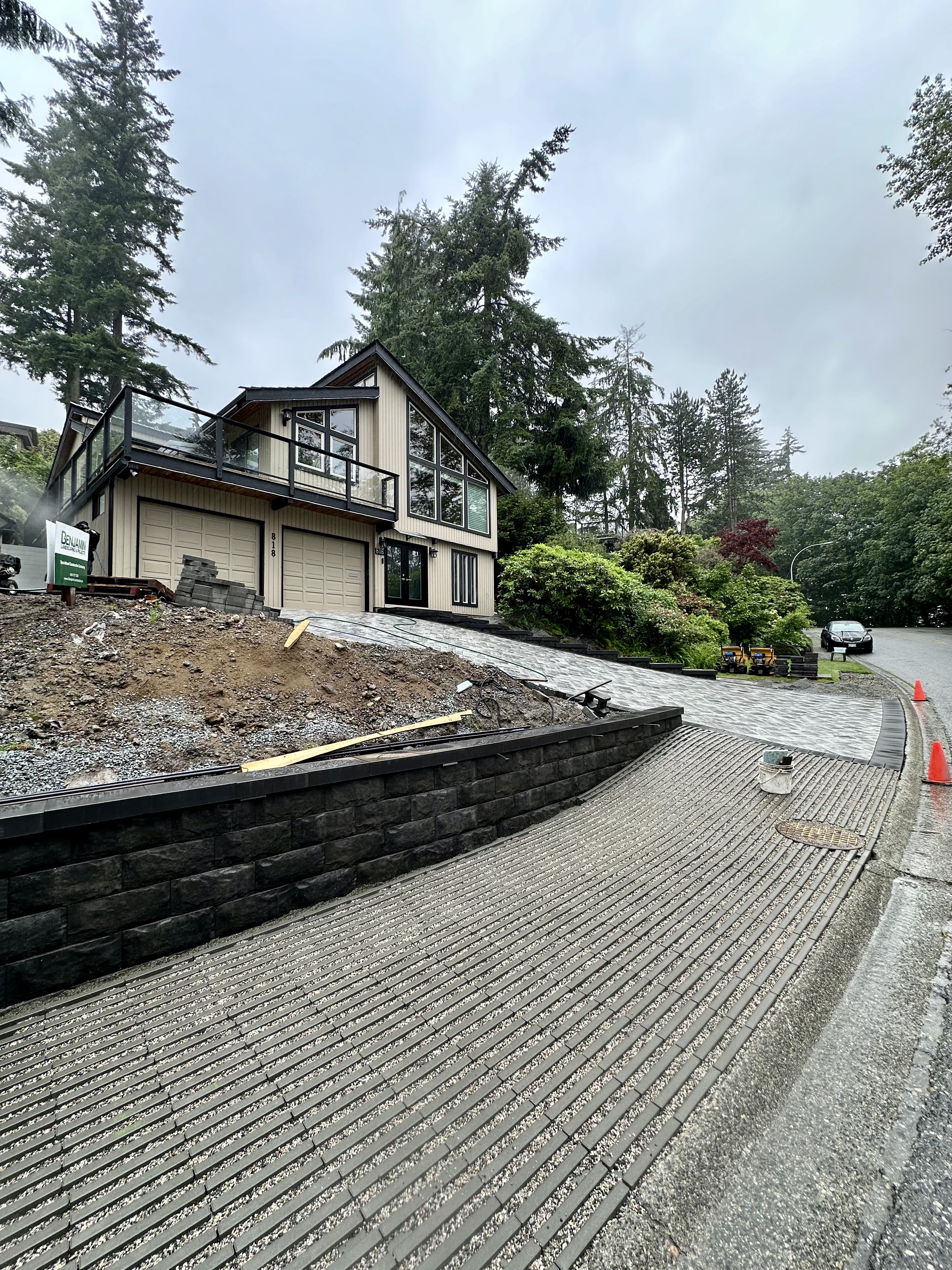 Interlocking paver driveway, retaining wall in Coquitlam by Benjamin Landscaping and Projects. 