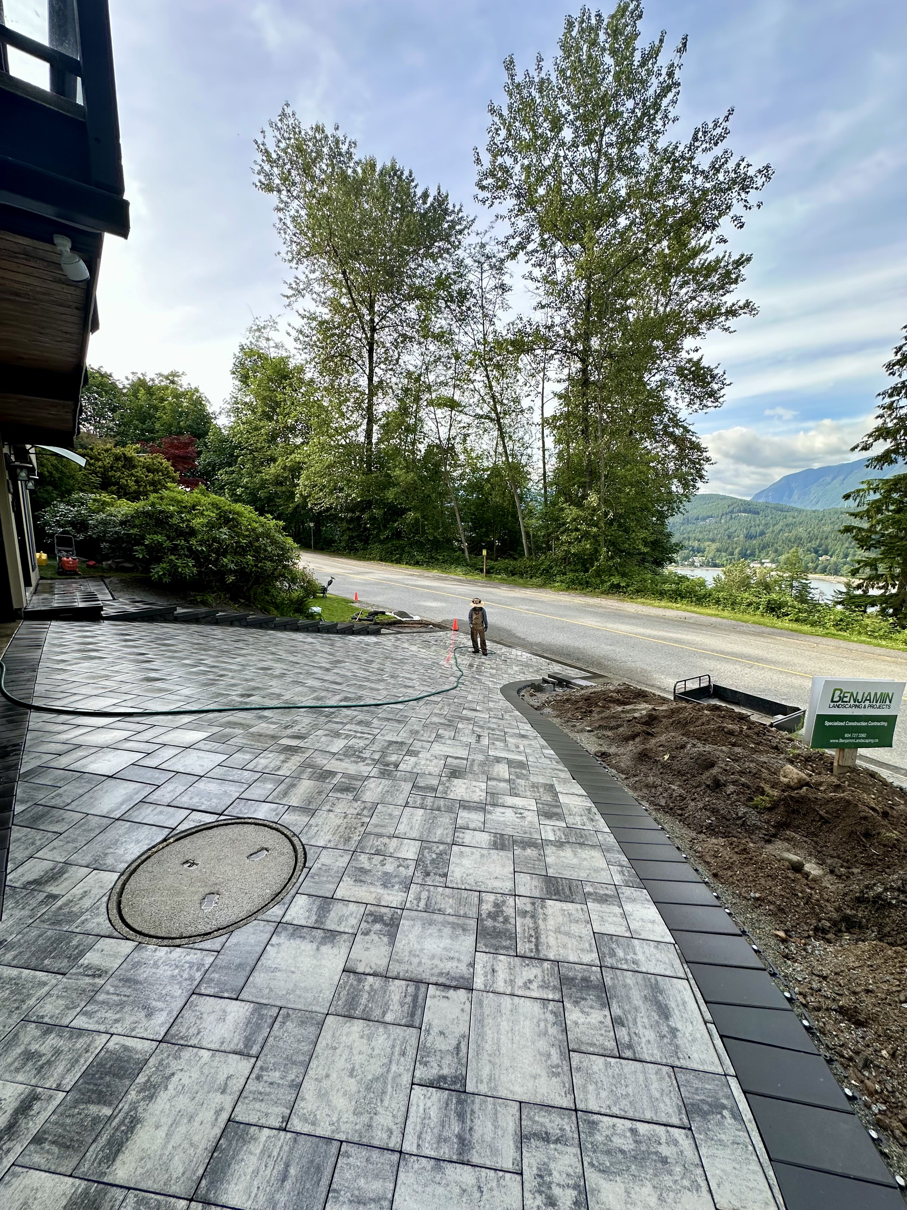 Interlocking paver driveway, retaining wall in Coquitlam by Benjamin Landscaping and Projects. 