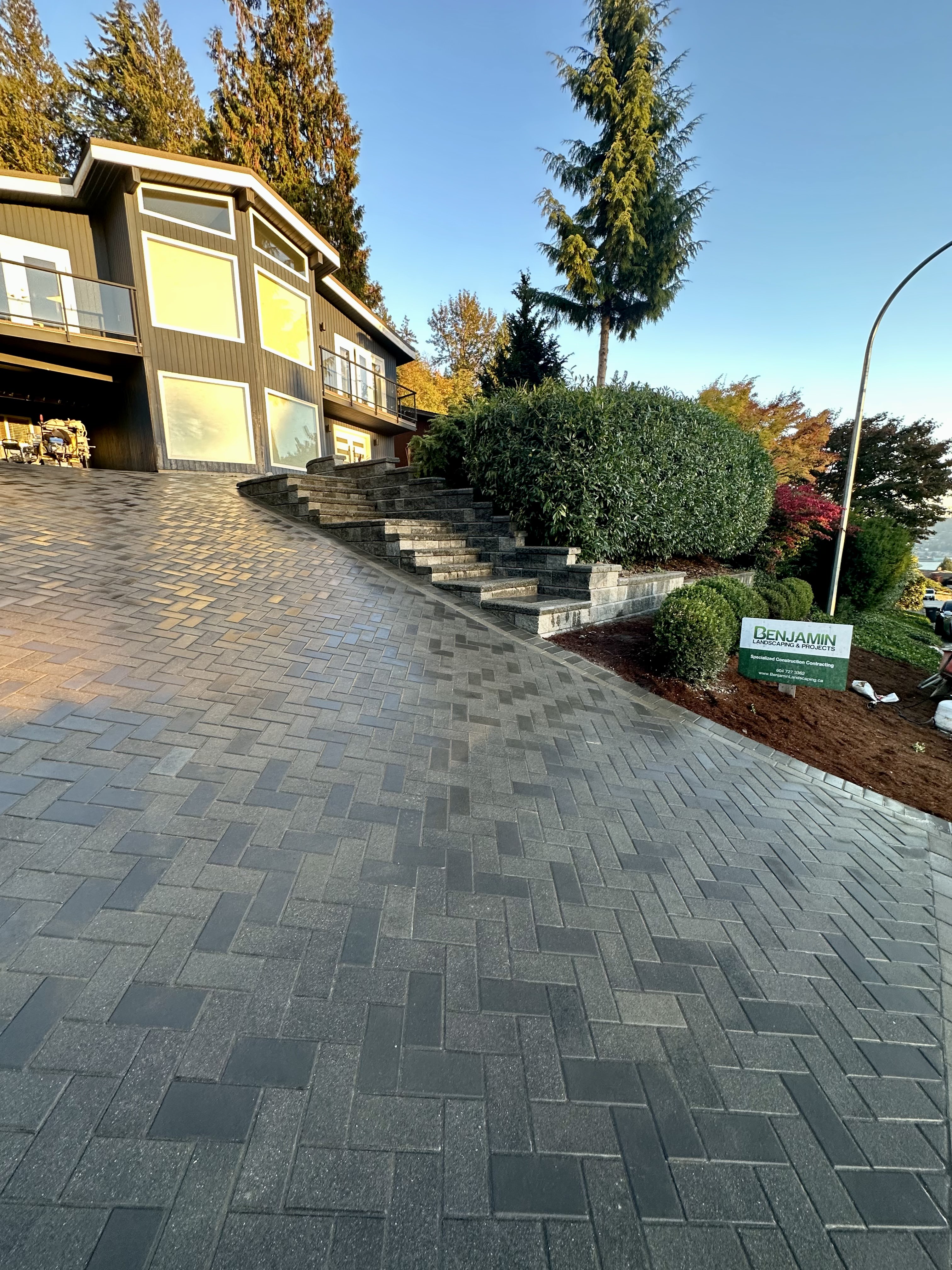 Interlocking paver driveway completed by Benjamin Landscaping and Projects.