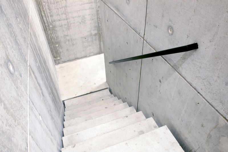 Concrete stairs, concrete walls.