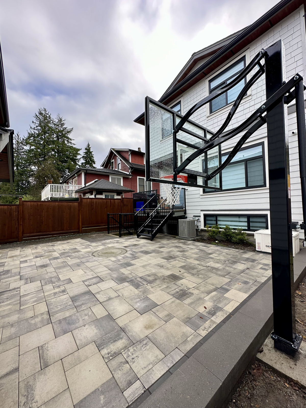 Paver sports court in North Vancouver by Benjamin Landscaping and Projects. 