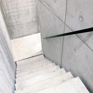 Concrete stairs, concrete walls.